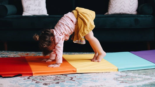 Small child playing on our Five-Panel Folding Gymnastics Tumbling Mat.