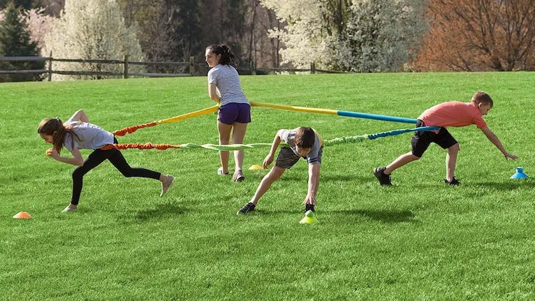 Four people playing our Multi-Way Tug-of-War Game. 