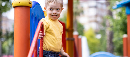 Child smiling on the playground.