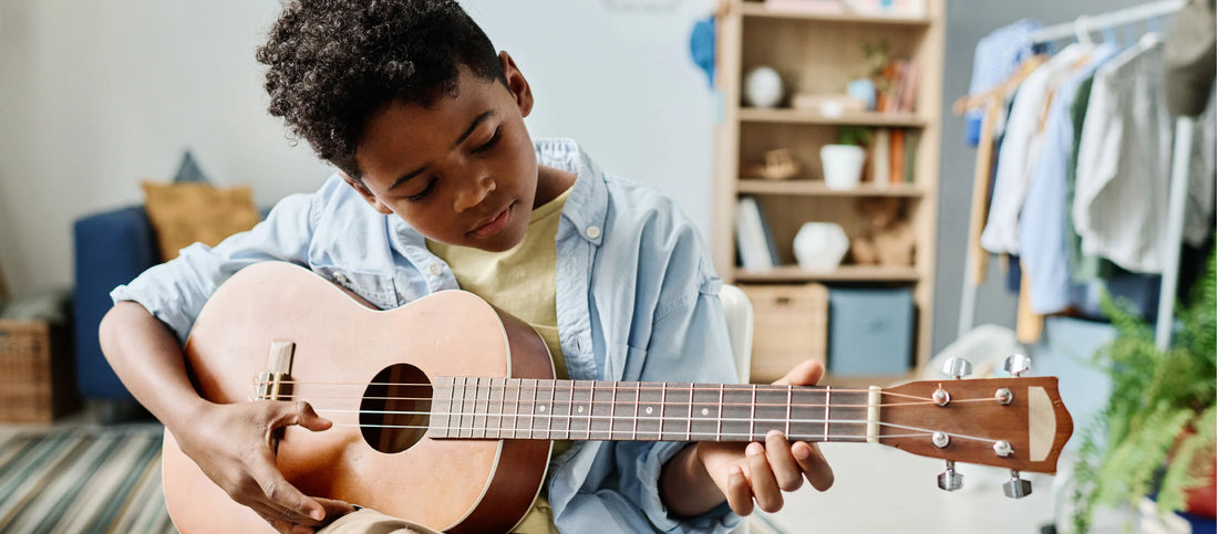 Boy playing guitar. 